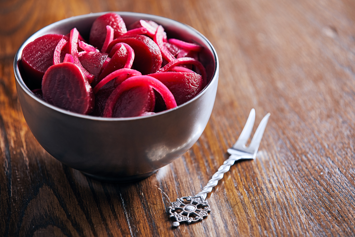 Pickled Beets in a bowl with a fork next to it