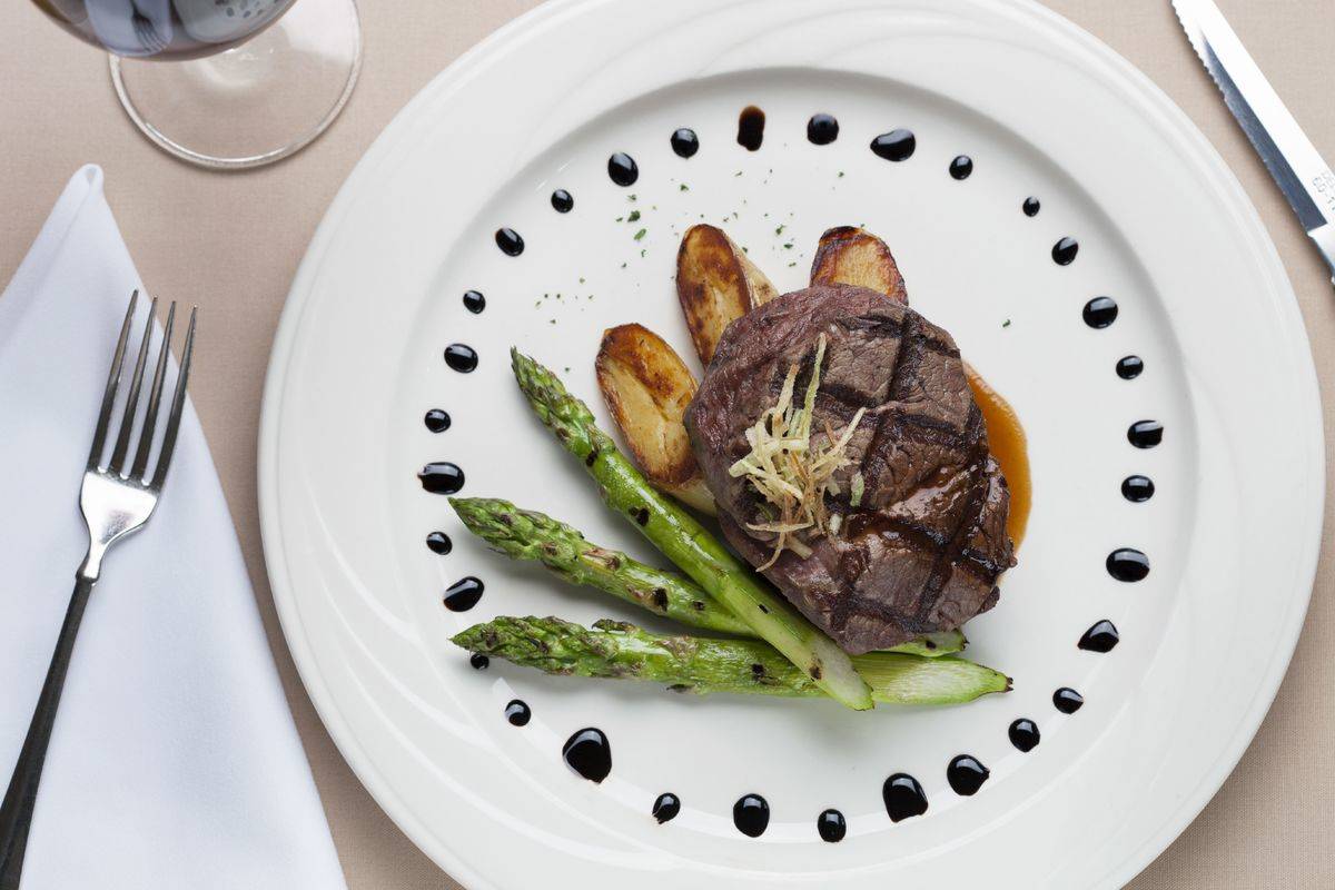 Overhead shot of filet mignon with asparagus and potatoes